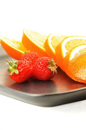 simsearch:400-05891431,k - orange & strawberries on a plate on white background Stock Photo - Budget Royalty-Free & Subscription, Code: 400-04895446