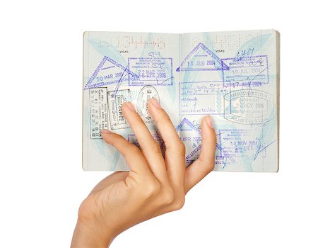 passport stamp - Hand showing passport, close-up shot. Isolated over white background. Stock Photo - Budget Royalty-Free & Subscription, Code: 400-04897734