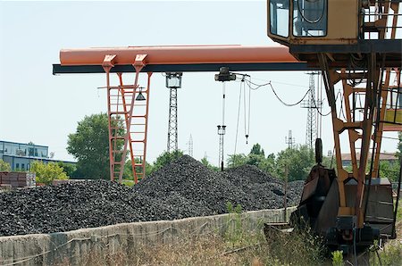 Crane and piles of coal. Lading base Stock Photo - Budget Royalty-Free & Subscription, Code: 400-04898135