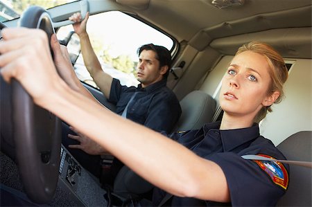 simsearch:400-05343071,k - Ambulance driver and colleague on the way to an emergency Stock Photo - Budget Royalty-Free & Subscription, Code: 400-04890148