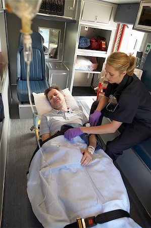 simsearch:400-05343071,k - Paramedic with patient in ambulance Stock Photo - Budget Royalty-Free & Subscription, Code: 400-04890151