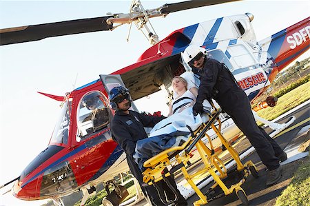 simsearch:400-05343071,k - Paramedics unloading patient from Medevac Stock Photo - Budget Royalty-Free & Subscription, Code: 400-04890180
