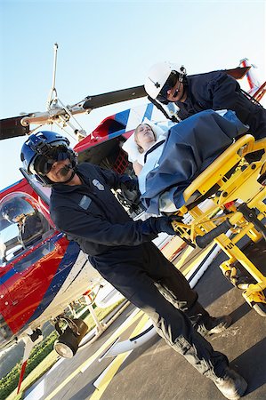 simsearch:400-05343071,k - Paramedics unloading patient from Medevac Stock Photo - Budget Royalty-Free & Subscription, Code: 400-04890181