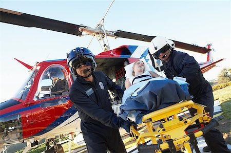simsearch:400-05343071,k - Paramedics unloading patient from Medevac Stock Photo - Budget Royalty-Free & Subscription, Code: 400-04890182