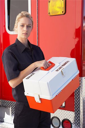 simsearch:400-05343071,k - Paramedic standing by ambulance with medical kit Stock Photo - Budget Royalty-Free & Subscription, Code: 400-04890199