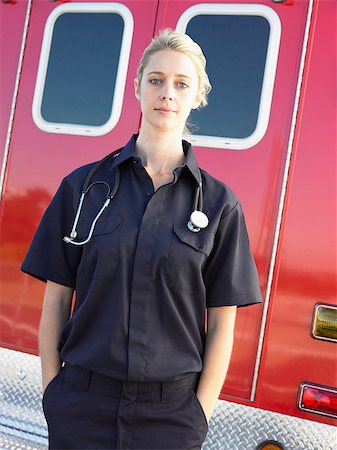 simsearch:400-05343071,k - Portrait of paramedic in front of ambulance Stock Photo - Budget Royalty-Free & Subscription, Code: 400-04890207