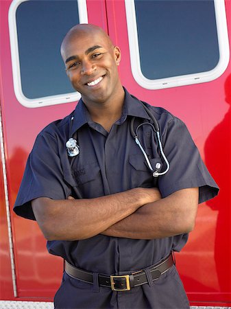simsearch:400-05343071,k - Portrait of paramedic in front of ambulance Stock Photo - Budget Royalty-Free & Subscription, Code: 400-04890211