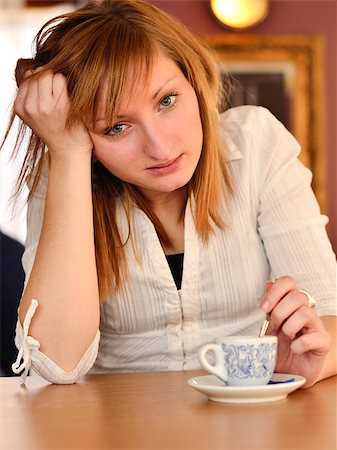 Beautiful young girl dtinking coffee Stock Photo - Budget Royalty-Free & Subscription, Code: 400-04890651