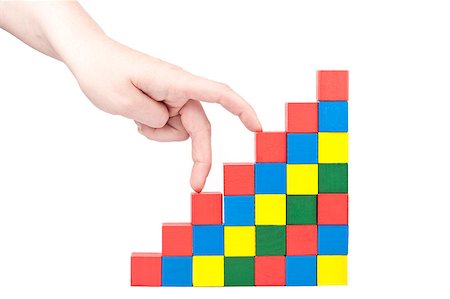 simsearch:600-02346205,k - Female hand climbing upstairs which is made from wooden toy blocks Stock Photo - Budget Royalty-Free & Subscription, Code: 400-04893573
