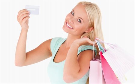 simsearch:400-04904785,k - Woman with shopping bags and a credit card in a studio Stock Photo - Budget Royalty-Free & Subscription, Code: 400-04904774