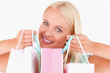 simsearch:400-04904785,k - Close up of a woman holding bags in a studio Stock Photo - Budget Royalty-Free & Subscription, Code: 400-04904778
