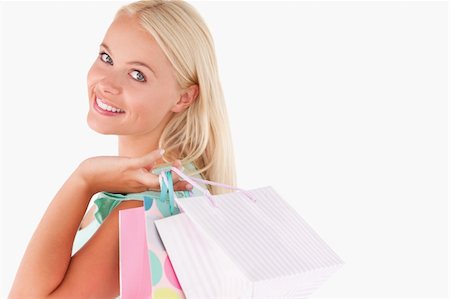 simsearch:400-04904785,k - Portrait of a Joyful blond woman with shopping bags in a studio Stock Photo - Budget Royalty-Free & Subscription, Code: 400-04904772
