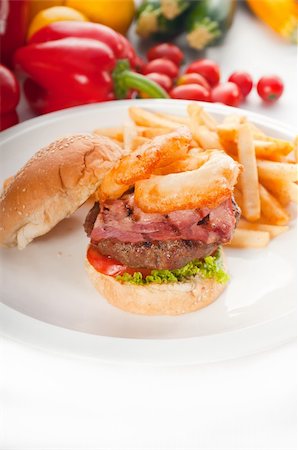 simsearch:400-06090558,k - classic american hamburger sandwich with onion rings and french fries,with fresh vegetables on background, MORE DELICIOUS FOOD ON PORTFOLIO Stock Photo - Budget Royalty-Free & Subscription, Code: 400-04908233