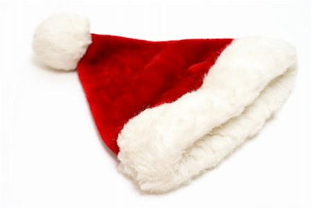 simsearch:400-08491819,k - An isolated santa hat ready to be worn by the big guy on Christmas. Photographie de stock - Aubaine LD & Abonnement, Code: 400-04909110