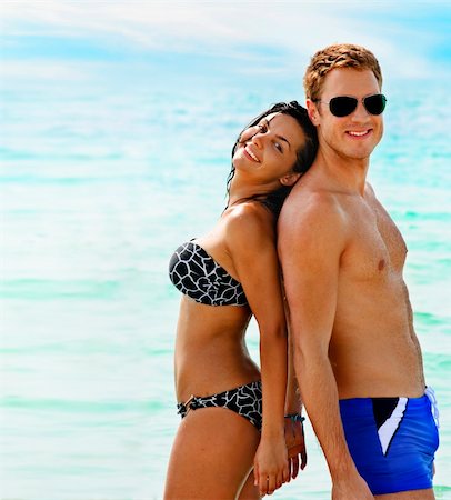 Beautiful smiling young couple having fun in the sea Stock Photo - Budget Royalty-Free & Subscription, Code: 400-04900329