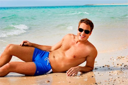 sandi model - Happy smiling man laying on the beach Stock Photo - Budget Royalty-Free & Subscription, Code: 400-04900330