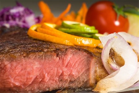 simsearch:400-06079651,k - fresh juicy beef ribeye steak sliced ,with lemon and orange peel on top  and vegetable beside Stock Photo - Budget Royalty-Free & Subscription, Code: 400-04901655