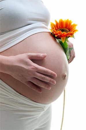 simsearch:400-05716366,k - Young Mother holding a sunflower on white background Stock Photo - Budget Royalty-Free & Subscription, Code: 400-04901814