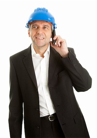 Portrait of architect wearing blue hard hat and talking on mobile phone. Isolated on white Stock Photo - Budget Royalty-Free & Subscription, Code: 400-04915387