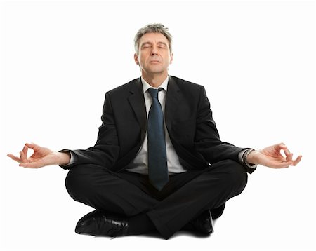 Businessman sitting in lotus flower position of yoga. Isolated on white Stock Photo - Budget Royalty-Free & Subscription, Code: 400-04915390