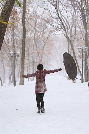 red trail - Girl with umbrella walking on the path. Winter. Trees with red leafs. Stock Photo - Budget Royalty-Free & Subscription, Code: 400-04916363