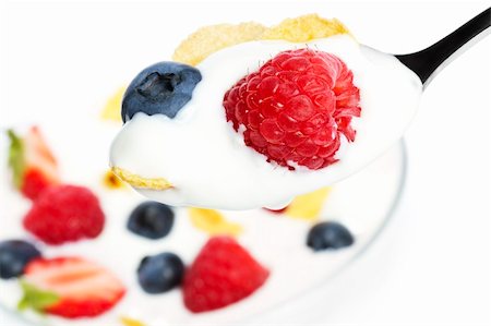 simsearch:824-07586355,k - spoon with yogurt blueberry and a raspberry and cornflakes over a dessert on white background Stock Photo - Budget Royalty-Free & Subscription, Code: 400-04916954