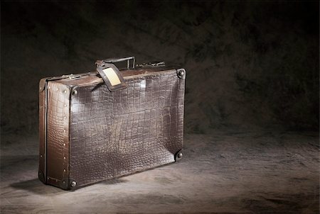 suitcase old - Old brown suitcase with a name tag. Stock Photo - Budget Royalty-Free & Subscription, Code: 400-04917434