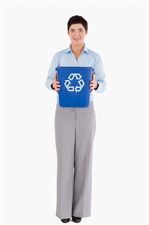 simsearch:400-07301131,k - Businesswoman showing a recycling bin against a white background Stock Photo - Budget Royalty-Free & Subscription, Code: 400-04917645