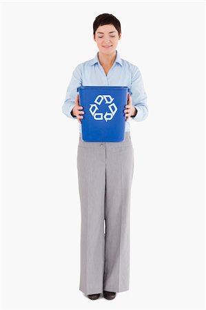 simsearch:400-07301131,k - Businesswoman holding a recycling bin against a white background Stock Photo - Budget Royalty-Free & Subscription, Code: 400-04917649