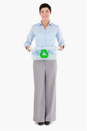 simsearch:400-07301131,k - Businesswoman holding a recycling box against a white background Stock Photo - Budget Royalty-Free & Subscription, Code: 400-04917655
