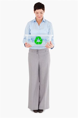 simsearch:400-07301131,k - Businesswoman looking at a recycling box against a white background Stock Photo - Budget Royalty-Free & Subscription, Code: 400-04917658