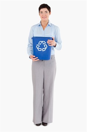 simsearch:400-07301131,k - Businesswoman with a recycling bin against a white background Stock Photo - Budget Royalty-Free & Subscription, Code: 400-04917651