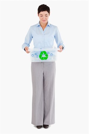 simsearch:400-07301131,k - Businesswoman with a recycling box against a white background Stock Photo - Budget Royalty-Free & Subscription, Code: 400-04917652