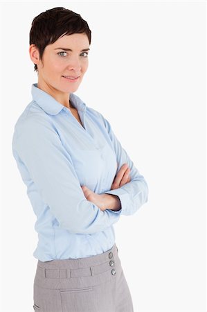 executive standing white background - Portrait of a businesswoman with the arms crossed against a white background Photographie de stock - Aubaine LD & Abonnement, Code: 400-04917670