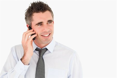 simsearch:400-05145011,k - Happy man making a phone call against a white background Stock Photo - Budget Royalty-Free & Subscription, Code: 400-04918099