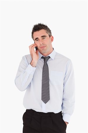 simsearch:400-05145011,k - Portrait of a businessman making a phone call against a white background Stock Photo - Budget Royalty-Free & Subscription, Code: 400-04918091