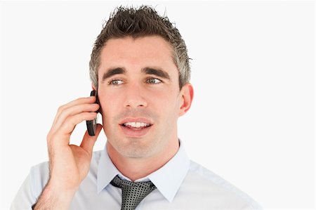 simsearch:400-05145011,k - Close up of a businessman making a phone call against a white background Stock Photo - Budget Royalty-Free & Subscription, Code: 400-04918101