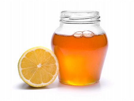 simsearch:400-05135233,k - A jar of honey and a lemon. Isolated on white background. Foto de stock - Super Valor sin royalties y Suscripción, Código: 400-04919425