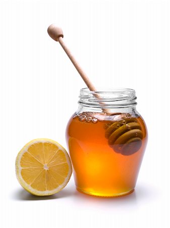 simsearch:400-05135233,k - Jar of honey with a wooden drizzler and a lemon. Isolated on white background. Foto de stock - Super Valor sin royalties y Suscripción, Código: 400-04919426