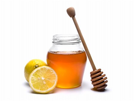 simsearch:400-05135233,k - Jar of honey with a wooden drizzler and lemons. Isolated on white background. Foto de stock - Super Valor sin royalties y Suscripción, Código: 400-04919428
