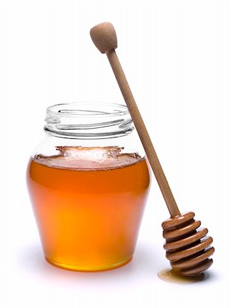 simsearch:400-05135233,k - Jar of honey with a wooden drizzler a side. Isolated on white background. Foto de stock - Super Valor sin royalties y Suscripción, Código: 400-04919429