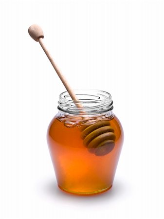 simsearch:400-05135233,k - Jar of honey with a wooden drizzler inside. Isolated on white background. Foto de stock - Super Valor sin royalties y Suscripción, Código: 400-04919423
