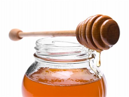simsearch:400-05135233,k - Jar of honey with a wooden drizzler on top. Isolated on white background. Foto de stock - Super Valor sin royalties y Suscripción, Código: 400-04919432