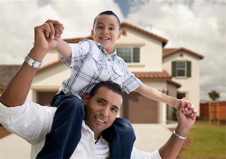 Playful Hispanic Father and Son in Front of Beautiful House. Foto de stock - Super Valor sin royalties y Suscripción, Código: 400-04919840