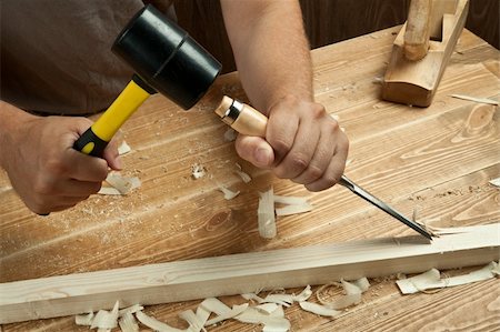 Wood workshop. Carpenter working with chisel. Stock Photo - Budget Royalty-Free & Subscription, Code: 400-04911095