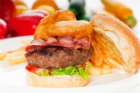 simsearch:400-06090558,k - classic american hamburger sandwich with onion rings and french fries,with fresh vegetables on background, MORE DELICIOUS FOOD ON PORTFOLIO Stock Photo - Budget Royalty-Free & Subscription, Code: 400-04911119