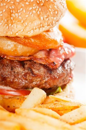 simsearch:400-06090558,k - classic american hamburger sandwich with onion rings and french fries, MORE DELICIOUS FOOD ON PORTFOLIO Stock Photo - Budget Royalty-Free & Subscription, Code: 400-04911120