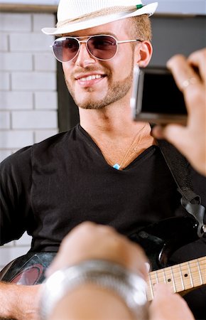 simsearch:400-04474927,k - Selective focus on guitar player with fans around. Stock Photo - Budget Royalty-Free & Subscription, Code: 400-04924490