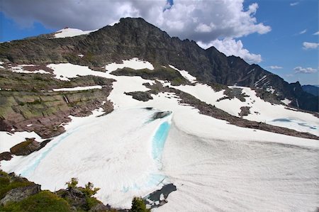 simsearch:400-05271081,k - Frozen lake below Sperry Glacier in Glacier National Park - USA. Photographie de stock - Aubaine LD & Abonnement, Code: 400-04924990