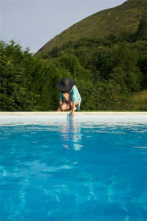 woman barefoot at swimming pool border in Asturias Spain Stock Photo - Budget Royalty-Free & Subscription, Code: 400-04925389